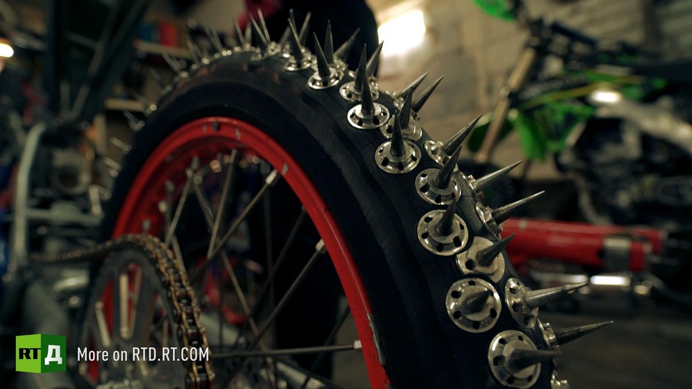 Motorcycle wheel with spikes for ice speedway racing. 