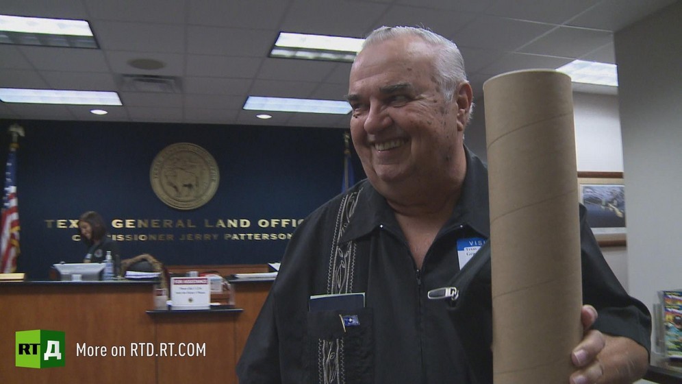 Republic of Texas Land Commissioner Ed Brannum carrying a cardboard roll visits the Texas General Land Office in Austin. Still taken from RTD documentary The Republic of Texas.