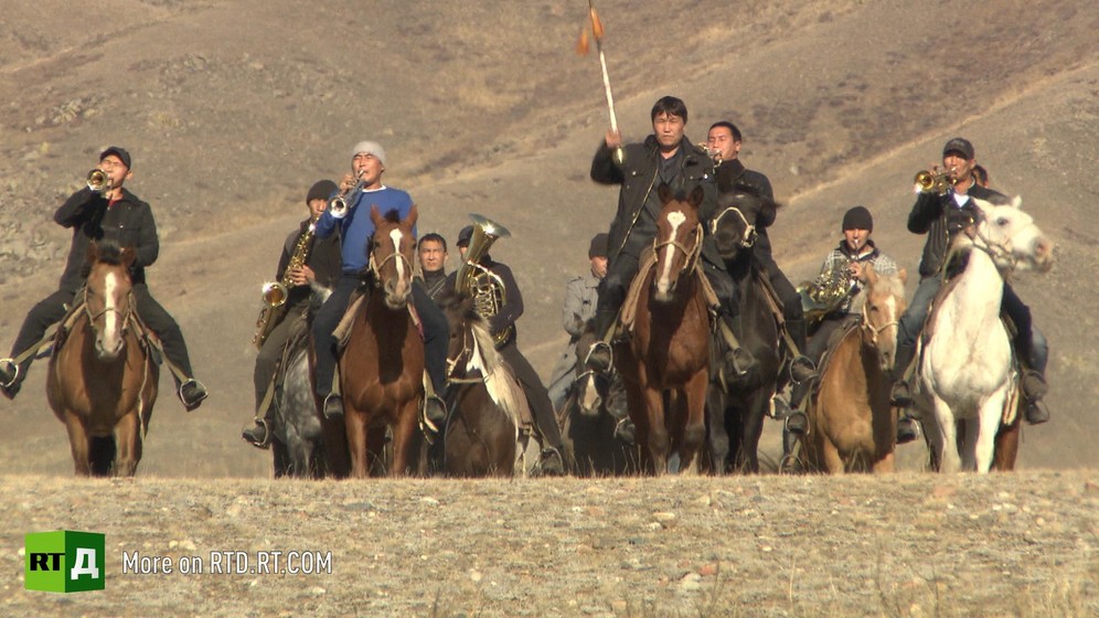 A band of Tuvan musicians on horseback playing musical instruments. Still taken from RTD documentary Tyva: The Sounds of Nature.
