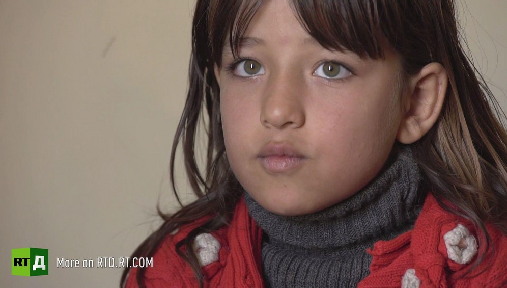 Face of frightened little girl from Aleppo Province, Syria. She had to serve as an auxiliary for rebel soldiers while Al Qaed then ISIS occupied her town. Still taken from RTD documentary about child fighters Where Childhood Died.