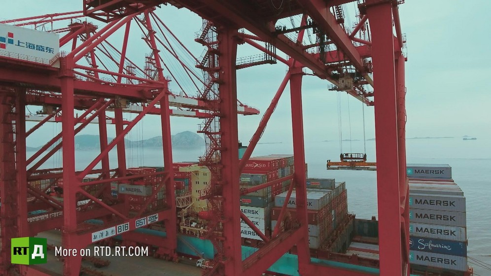 Cranes and container ships at Yangshan container port in China. Still taken from RTD documentary Yangshan City Port in the 'This is China' series.
