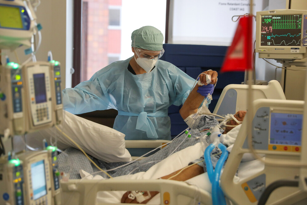 doctor attends to covid patient