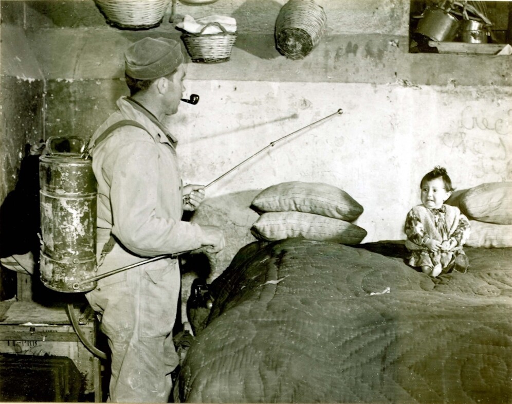 The soldier is spraying DDT mixed with kerosine, Italy, 1945