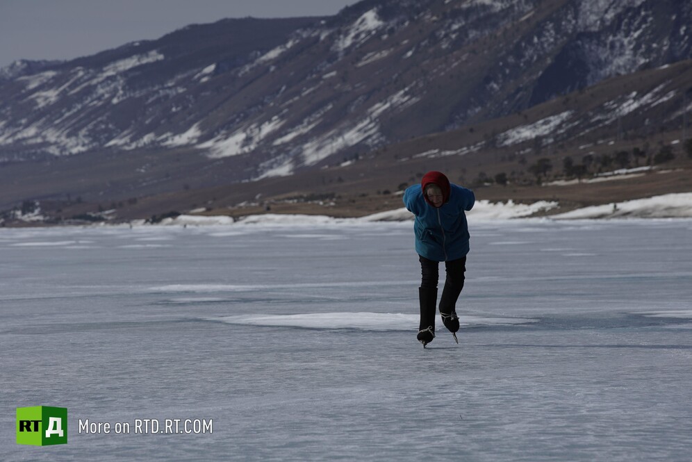 Grandmother skating on Lake Baikal